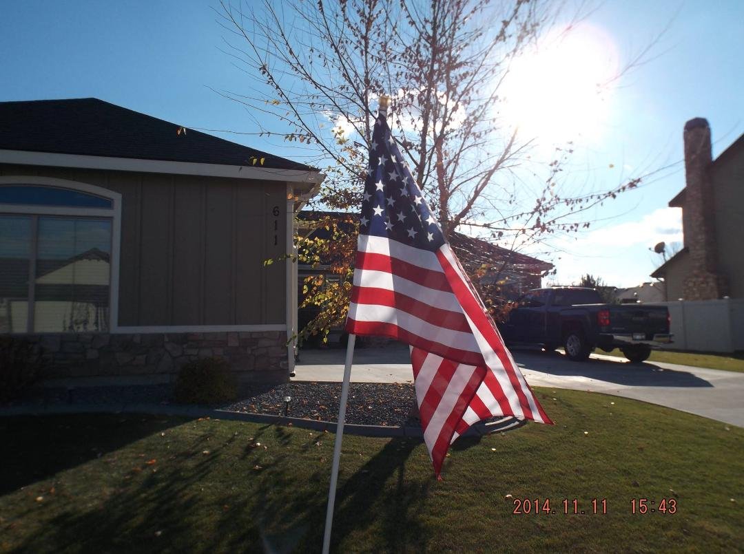 The Boy Scouts in our area put large flags in our yards.  They put them up & then take them down at sunset  :)  Veteran's Day 2014
