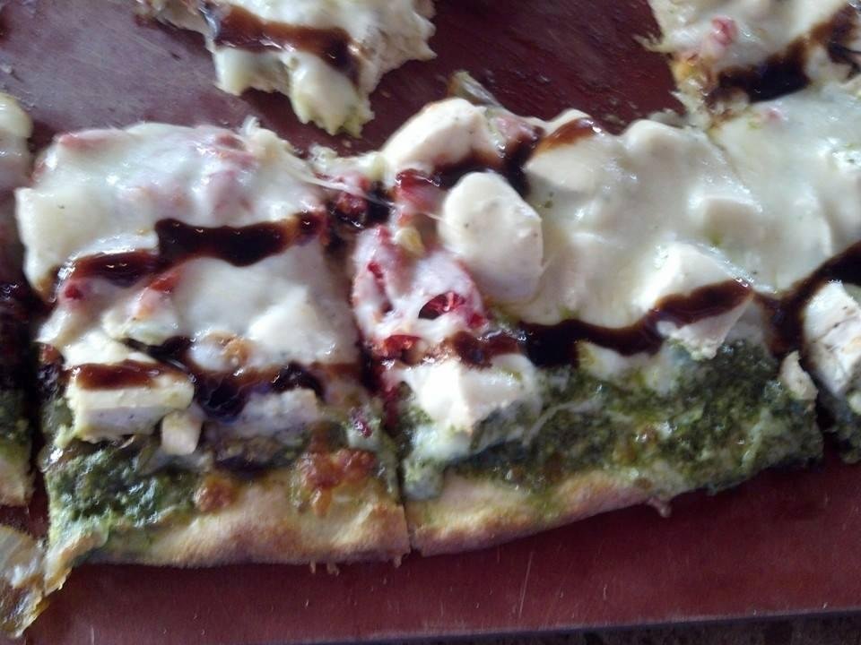 Some of my Basilico Flatbread at Naples Flatbread Restaurant with extra cheese and cream sauce, of course. I ate the rest! Read ingredients first comment.
