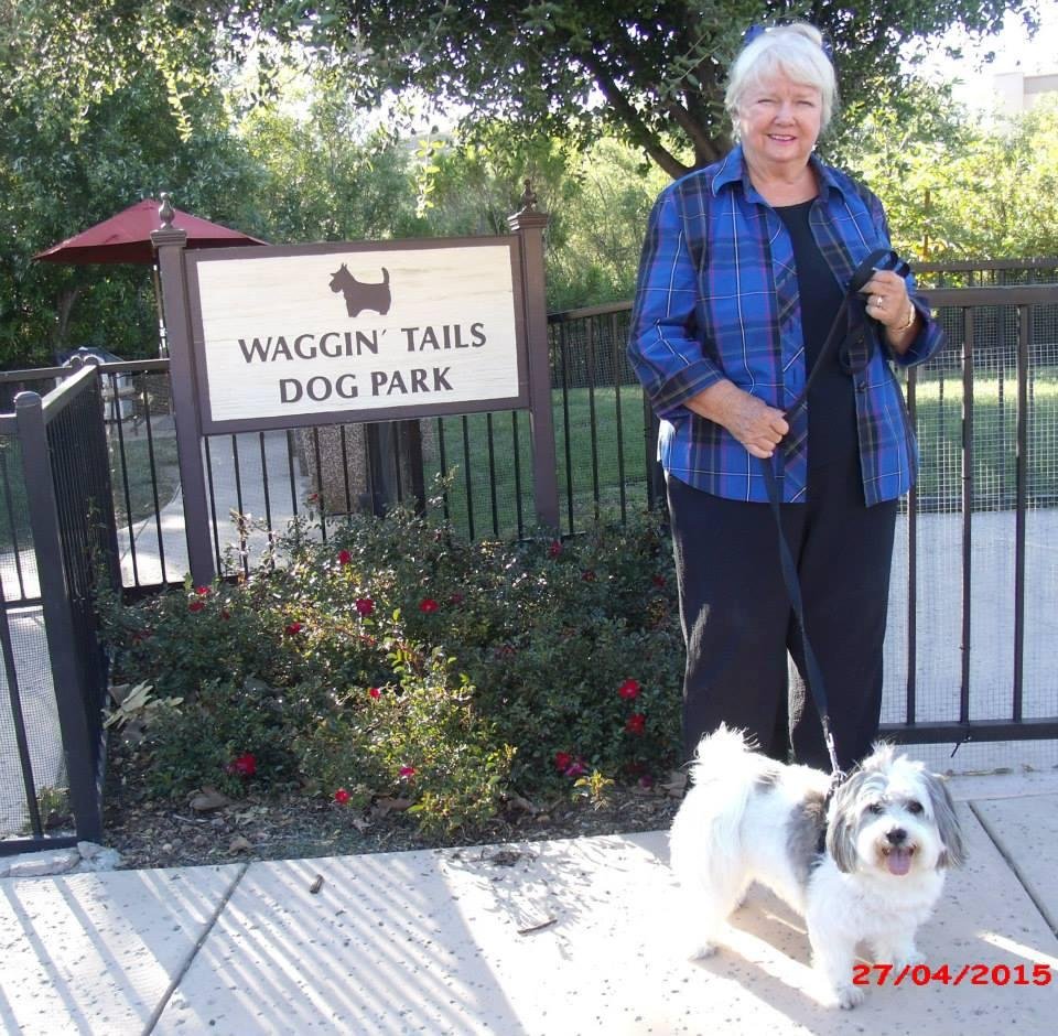 Lecy with her dog, Mozart at the gate leading to the dog park here at University Village. 2014