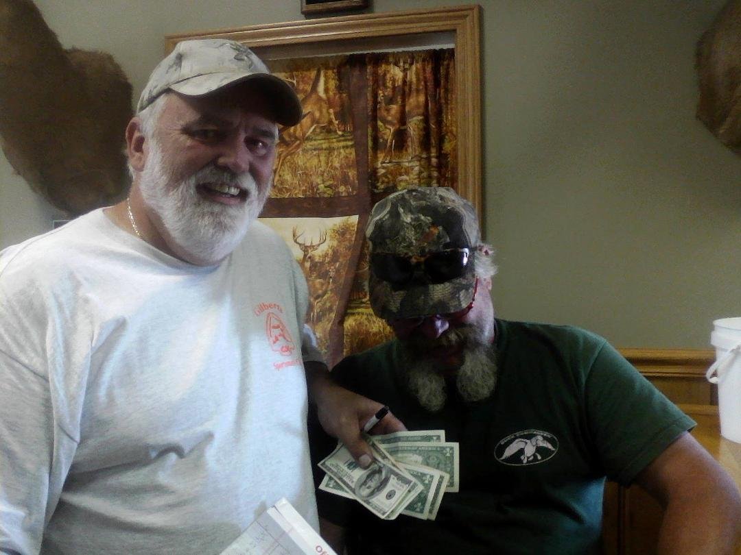T-Mack hanging his head in shame as Lou Leavens accepts payment for the beer tab after Gilberts Sportsmen Club kicked B&BS ass in the annual Brown Jug Shoot !!!