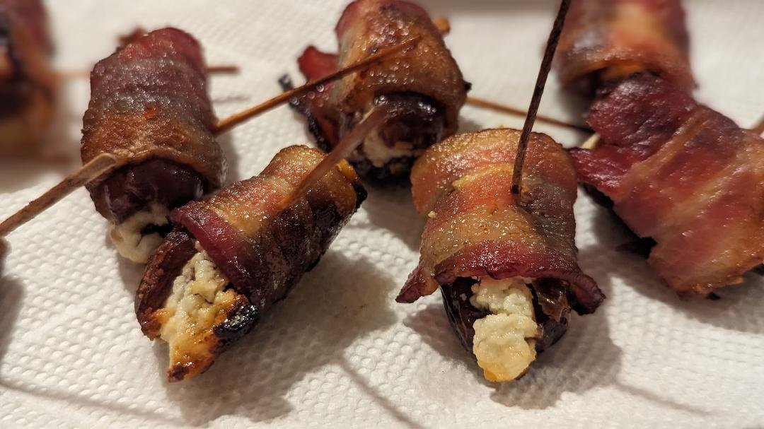 Bacon wrapped, goat cheese stuffed dates. Yum!