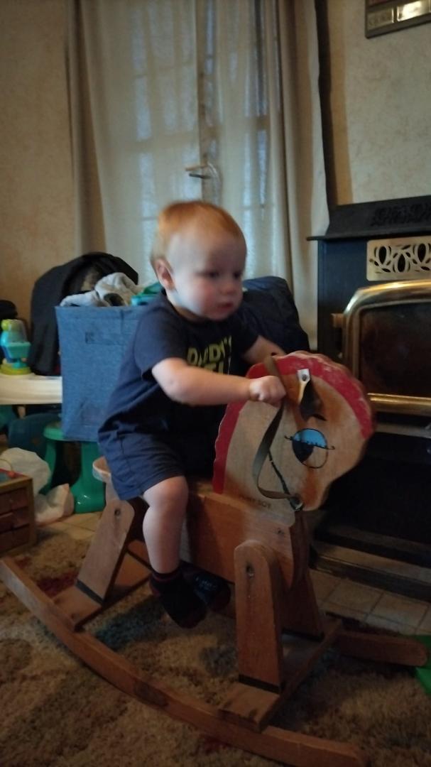 Wyatt is riding Pops Rocky horse. Pop would have n 80 in May.