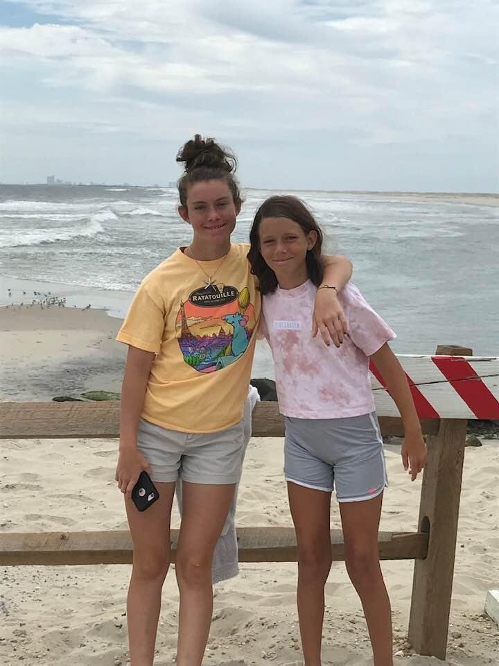 The girls with Atlantic City backdrop. Cloudy day
