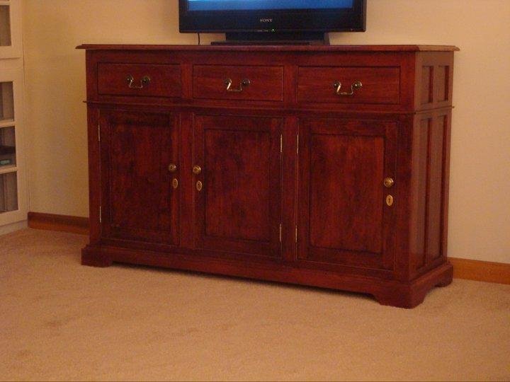 Winter Project. Built this buffet out of cherry wood with a curly cherry top. The top drawer fronts swing down to reveal DVD player, VHS player and satellite controller
