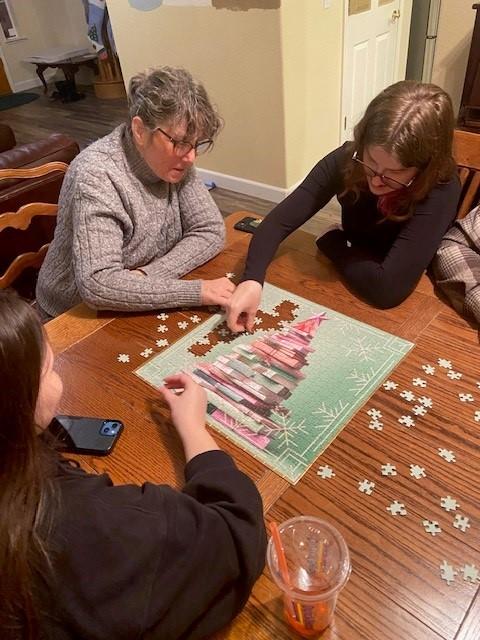 The Ladies at work at the Perpetual Puzzle table