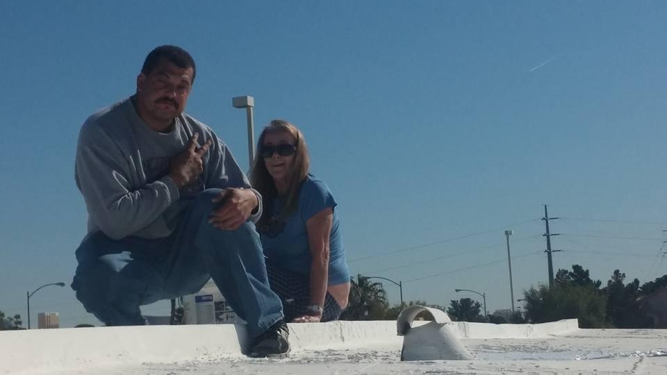 Me and Julie Strong weather proofing her roof