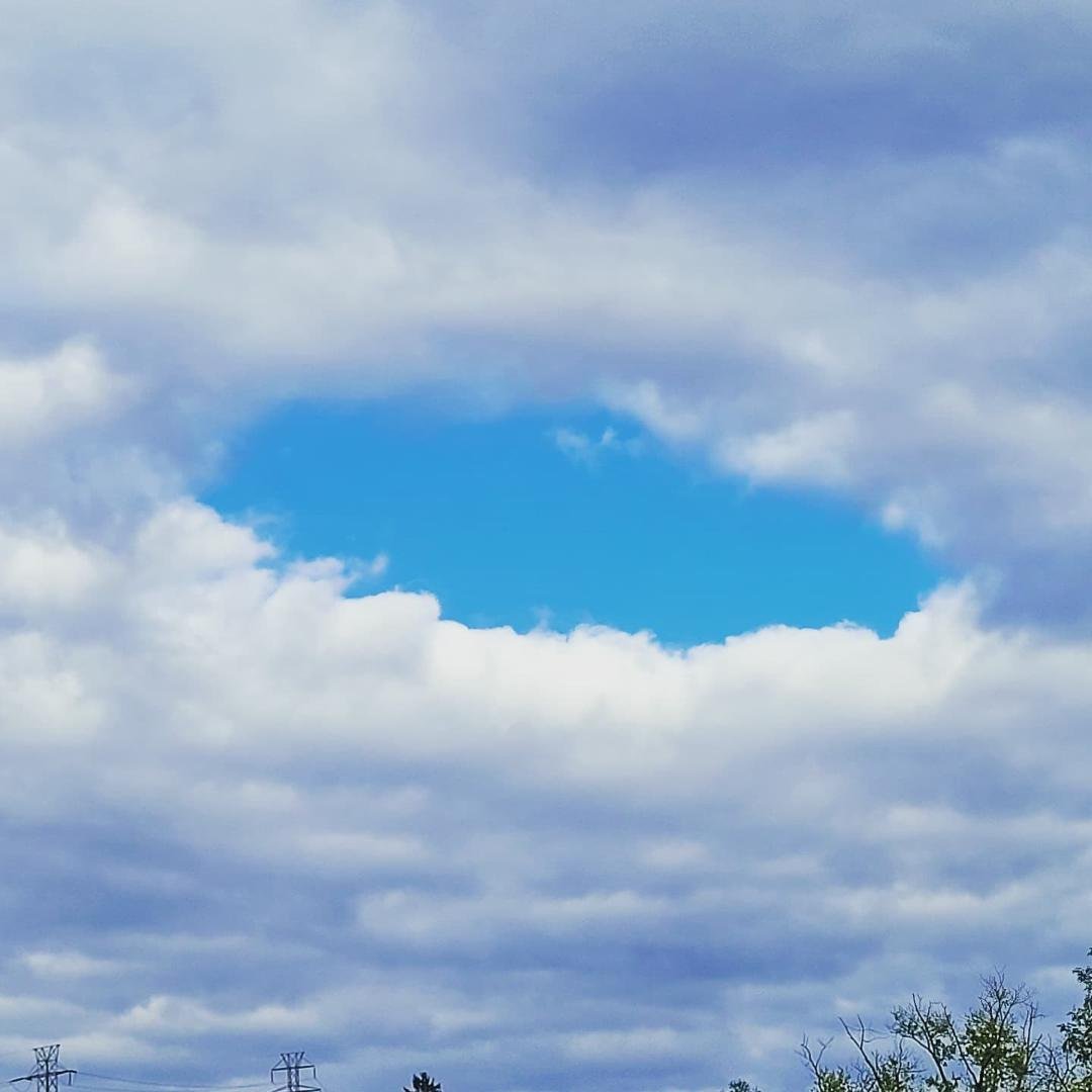 Just a perfect hole in the cloud cover.