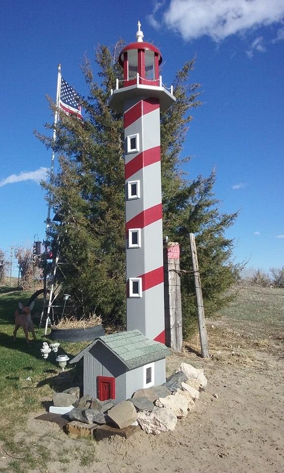 well here is the finished product with the rocks around the bottom. Thanks Roger, it looks beautiful and really lights up the yard.