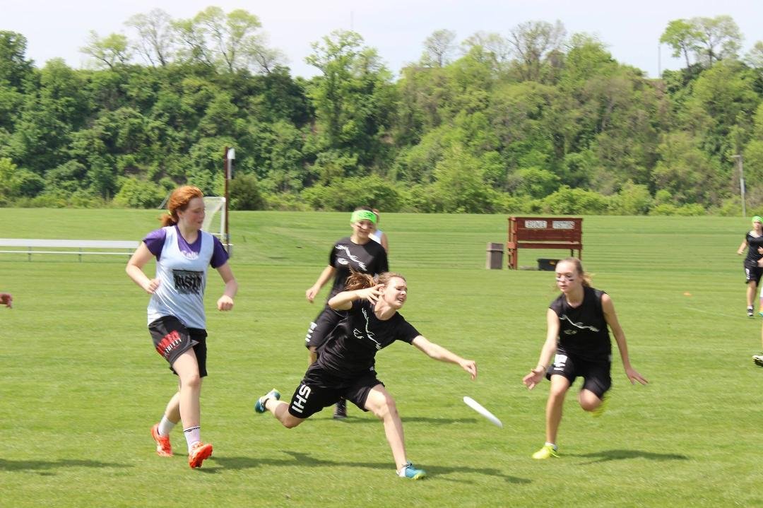 Reagan and Danielle trying to reach the disc.