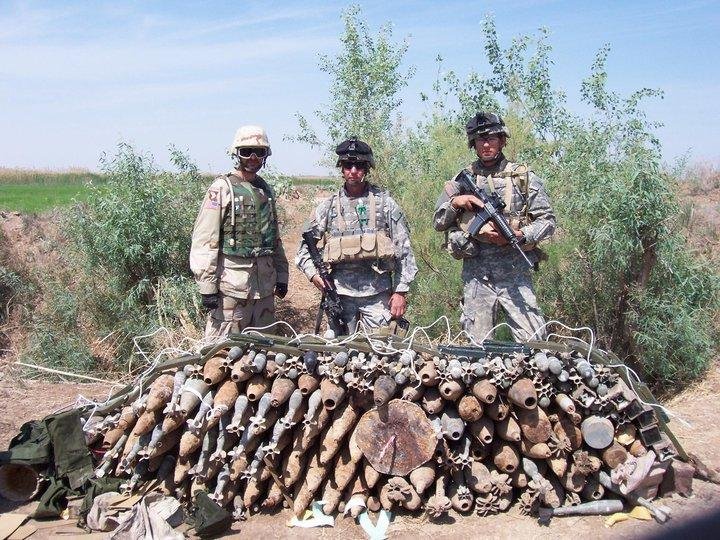 Jason on right with weapons he and his platoon dug up.(1st tourin Iraq)