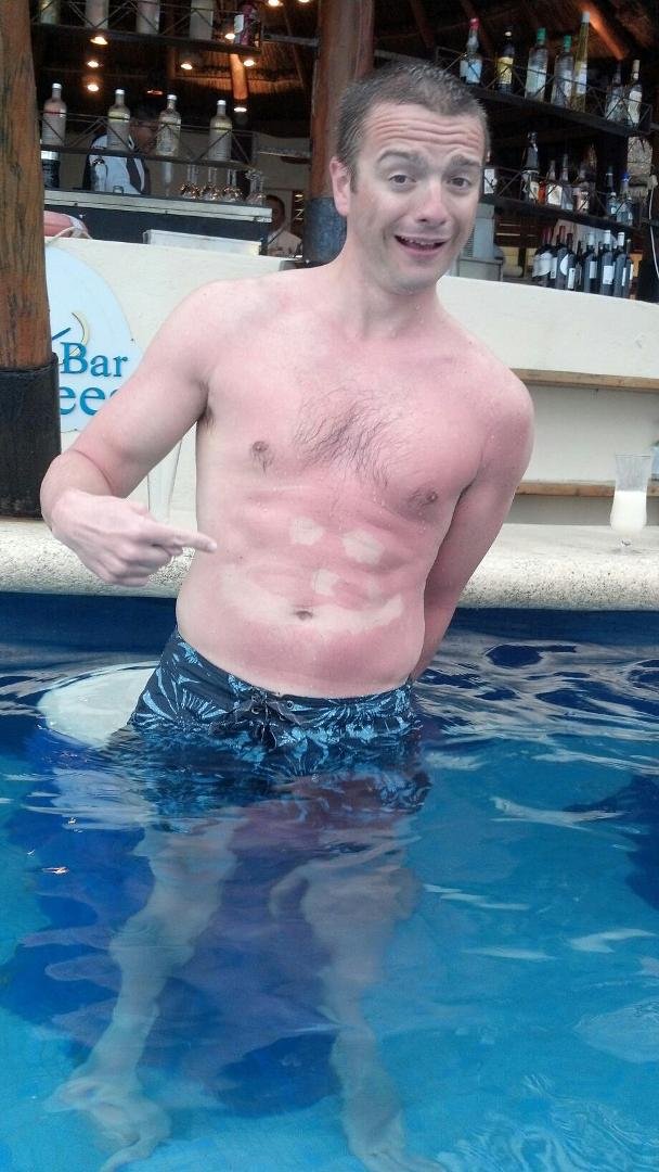 This is a result of 10 shots of 1800 Silver at the pool bar. Mr Happy Face on his tummy. Seemed like a good idea at the time.... not.
