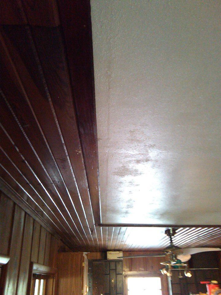 New ceiling. Replaced the middle of the living room with sheetrock, removing the old tongue and groove hardwood. Most of it was severely water damaged.
