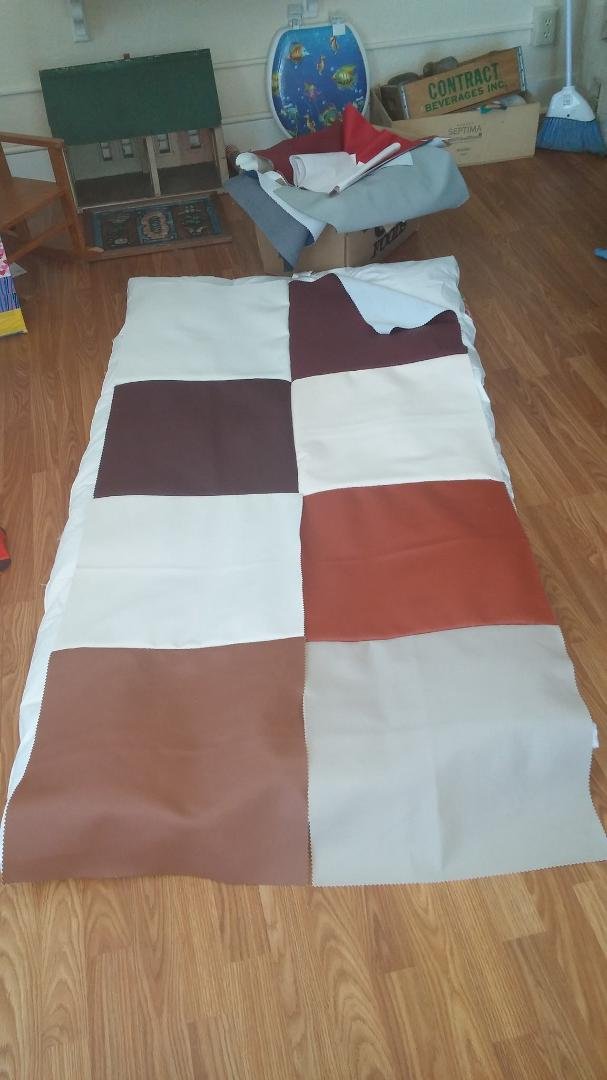 I found a box of pleather cute into big squares. Im sewing them together to make a very large floor pillow. I love thrift stores!!
