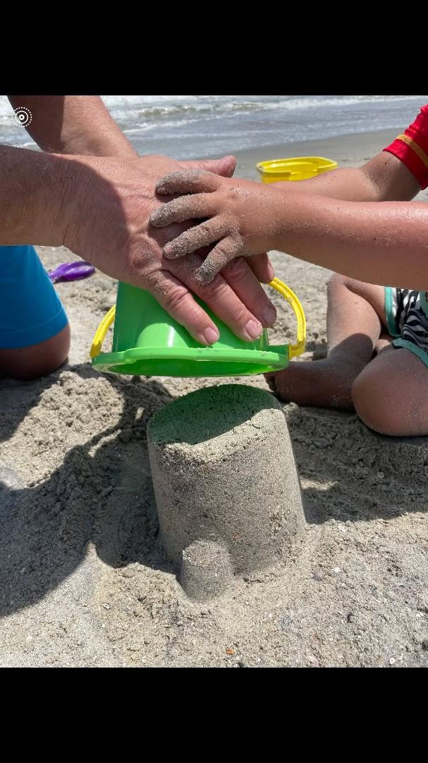There's something very special here. I got to build a sandcastle with Elliot, my grandson.
Isn't this the way that God works with us? We put our hands on His and we get to say "we helped". Hoping you will put your hands
