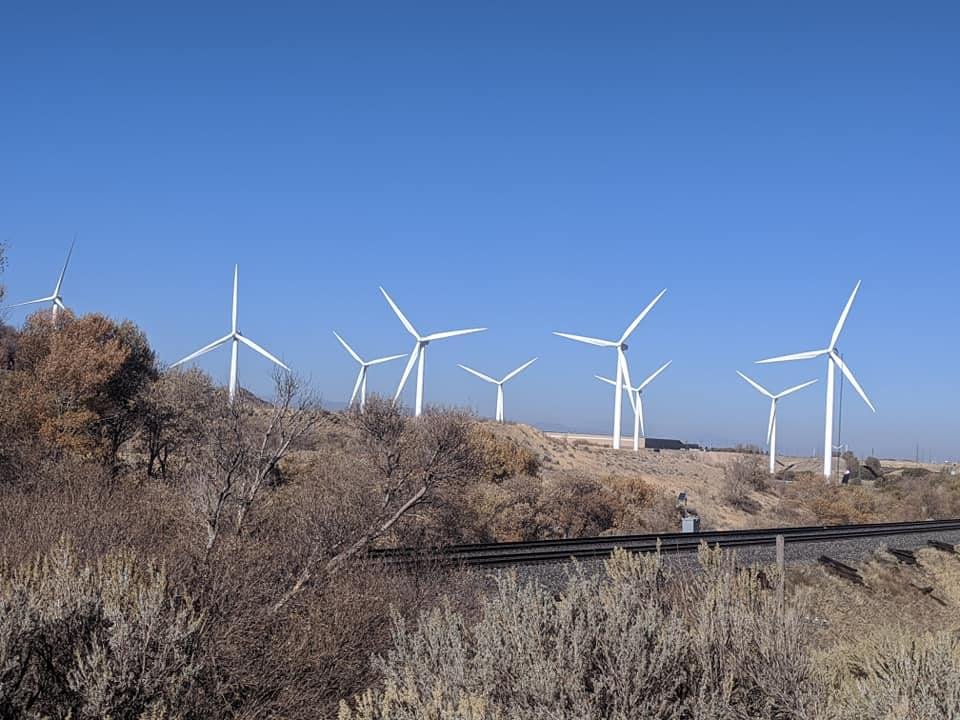 Outside of Provo, as the road cuts thru the mountain there is this copse of windmills, spinning in the breeze. It is much more dramatic w/the gorge walls on either side.