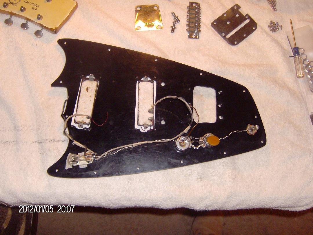 Here's a super cool story of one of the restorations I've done!
When I lived at Pismo Beach in the 80's a good friend of mine gave me a real basket case of a 1967 Hallmark guitar!!! In a jillion pieces!
About 20 years late