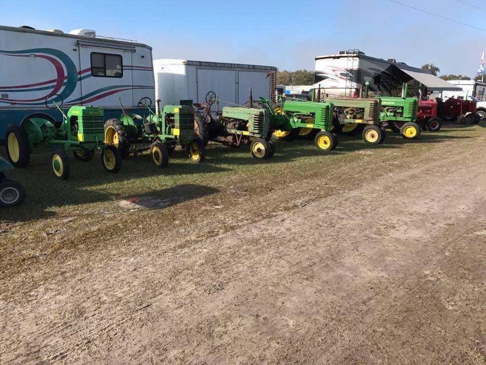 Millle and John Dixson's 6 of their 9 John Deere tractors at the Florida Flywheelers.