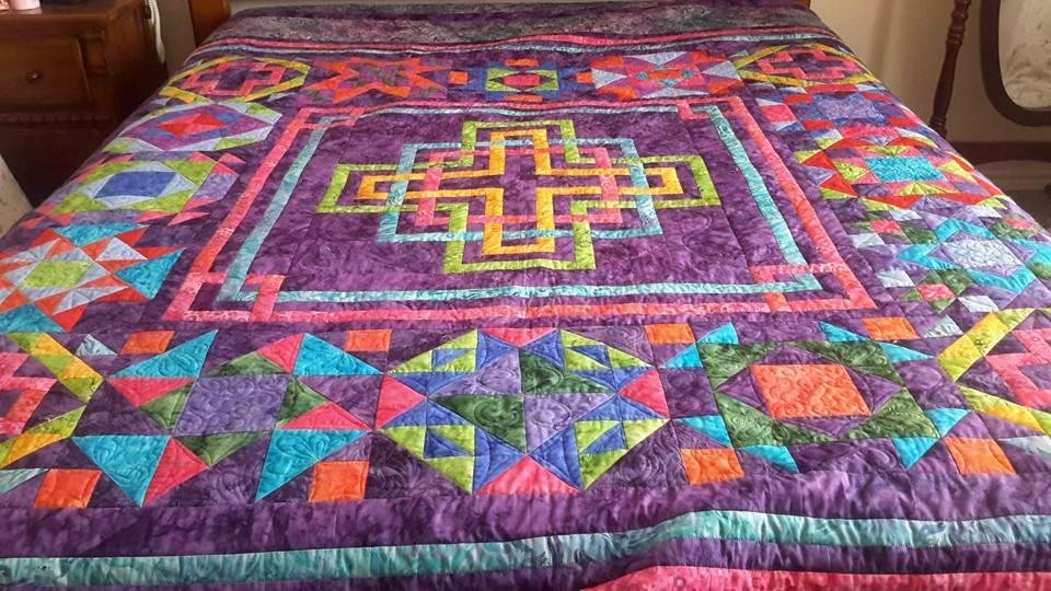 My quilt I just finished putting the binding on. I is a 100 inch square and fits my queen bed. It is called Celt Crystals. It was a block of the month. In this picture you can not see the border.