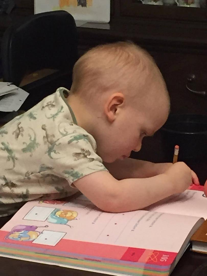 Matthew loves tracing numbers.