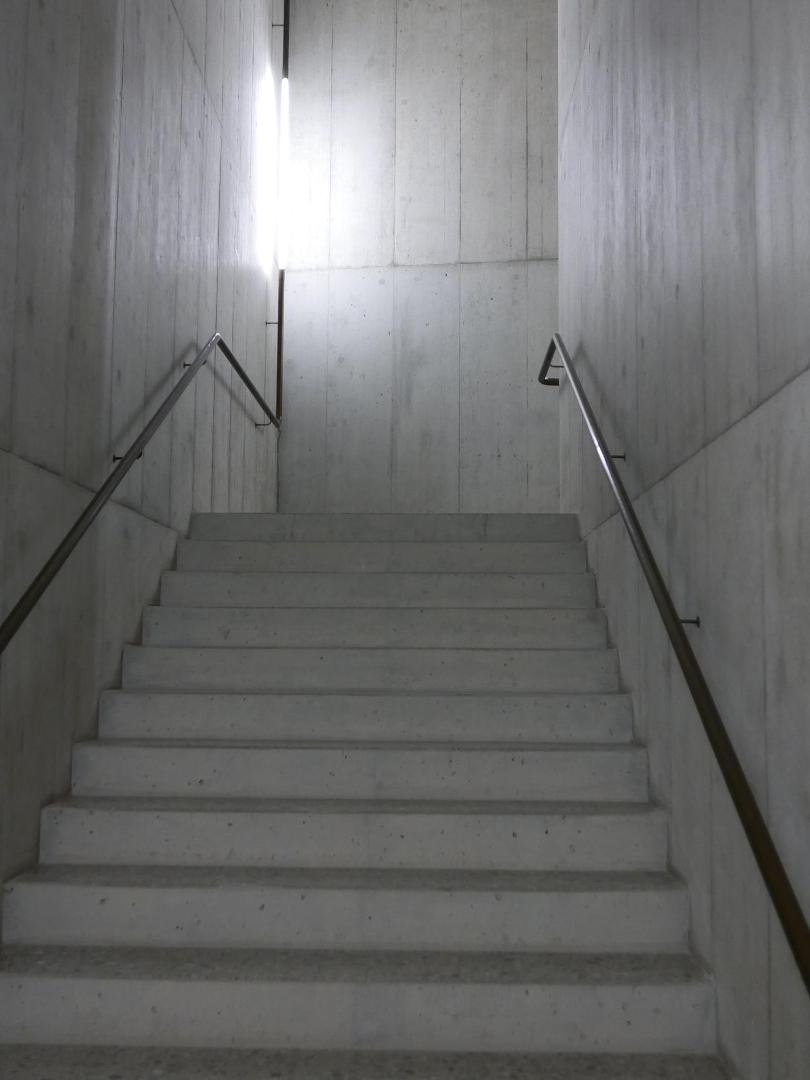 Brass stair rail and light fixture all in one!