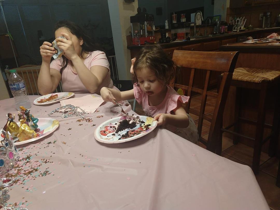 Arianna eats her cake.