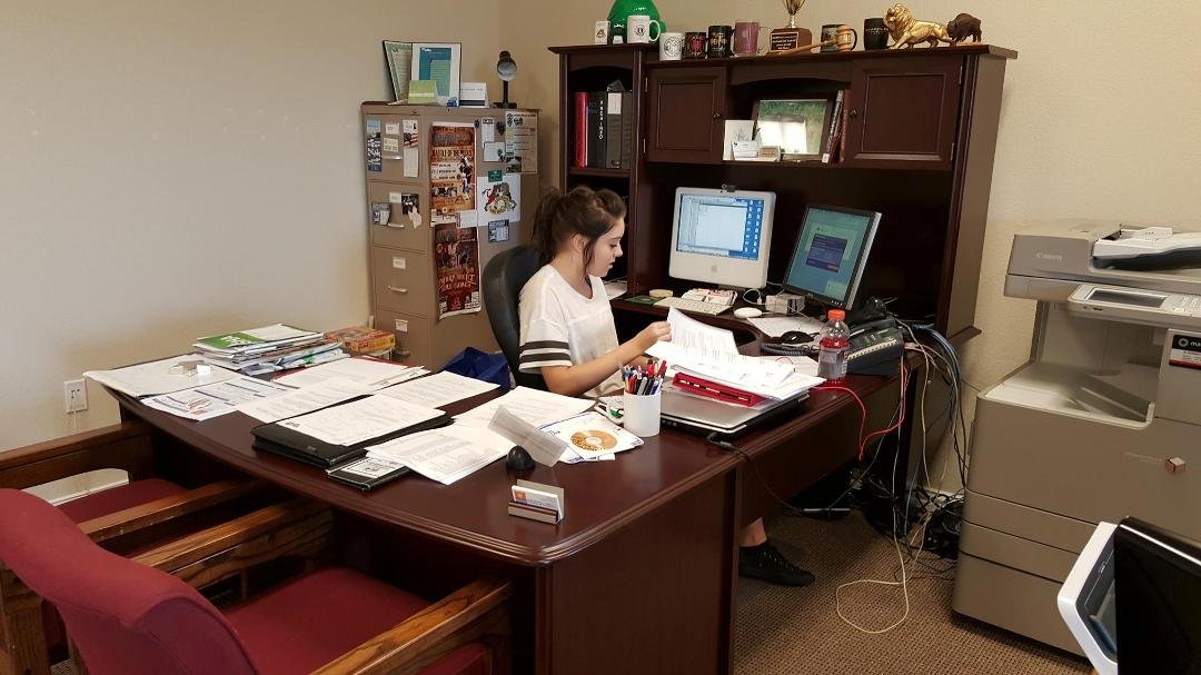 Shannon looks quite comfortable behind a desk.