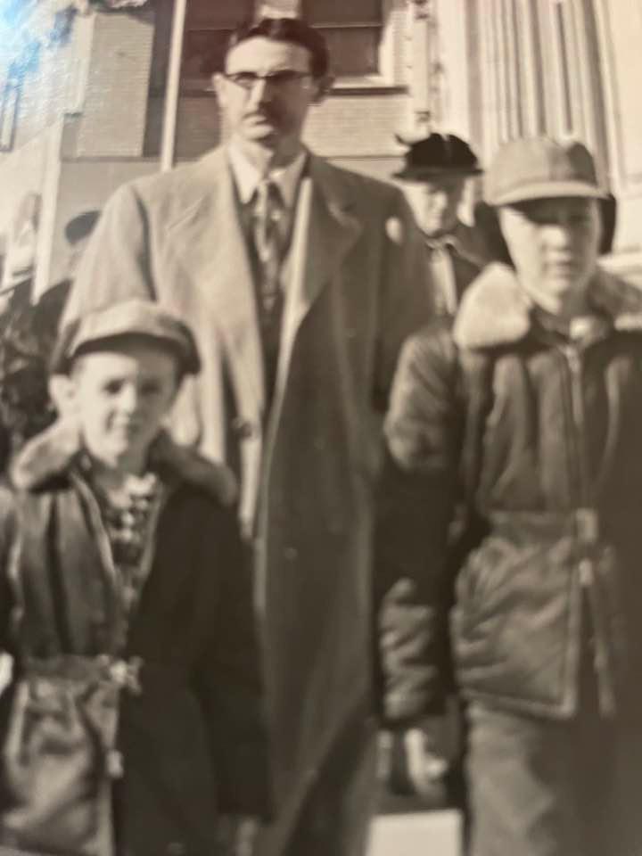 Anyone remember walking on Broadway in Wichita and having a man taking a photo and selling it to you? My dad, brother and me, early 1950’s!