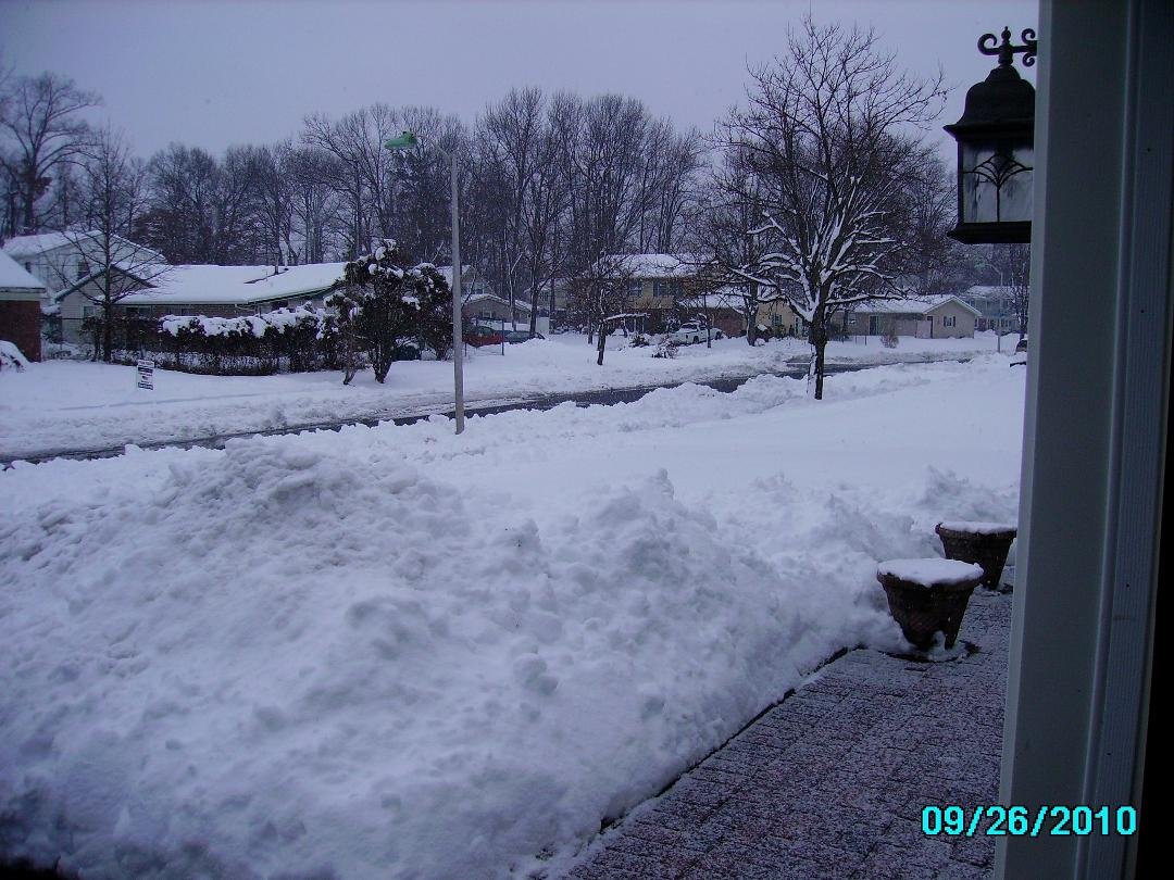 So, I don't know how many inches of snow we got yesterday, but I thought some of my California/Arizona friends would like to see what we are dealing with here. This is mom in front of the house and then what it looks like d