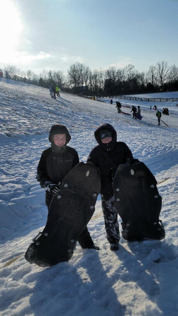 Our two grandsons Drew (L) and Nathanael (R) out sledding on a snow day in Oldham County, KY today.