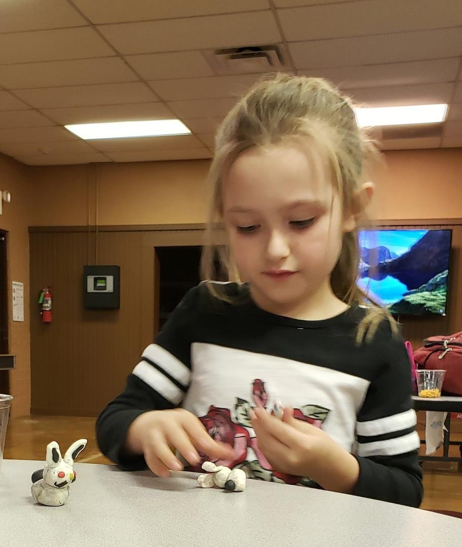 Jade making a clay bunny during Clover Kids meeting 💗