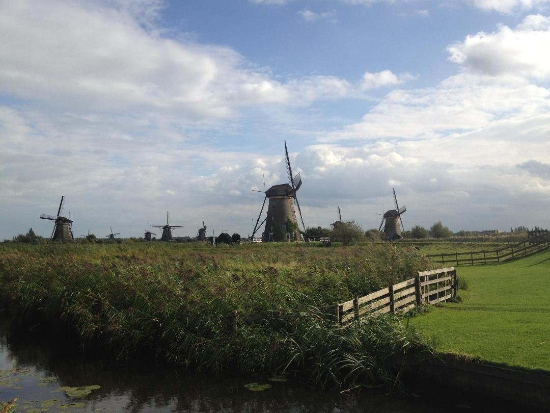 "The windmills whirl the winter--uh, autumn--in...". Kinderdijk, Netherlands