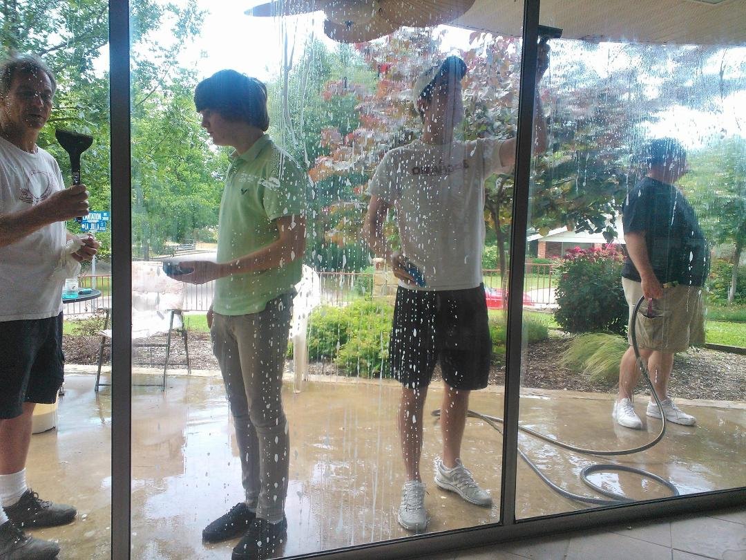 Isaac, Tim, and Brad hard at work raising money for camp.