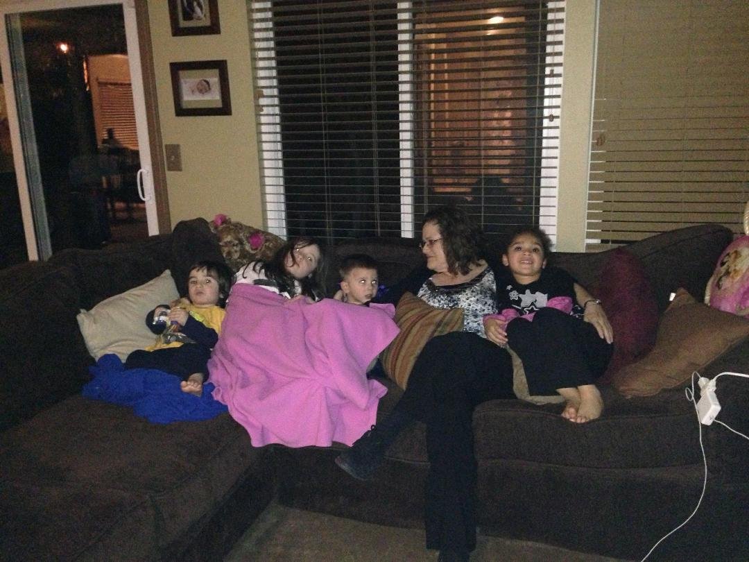 Four little grandkids sitting on the couch. Happy me!!! Korbin, Tyler, Luke, me, Mikaila.