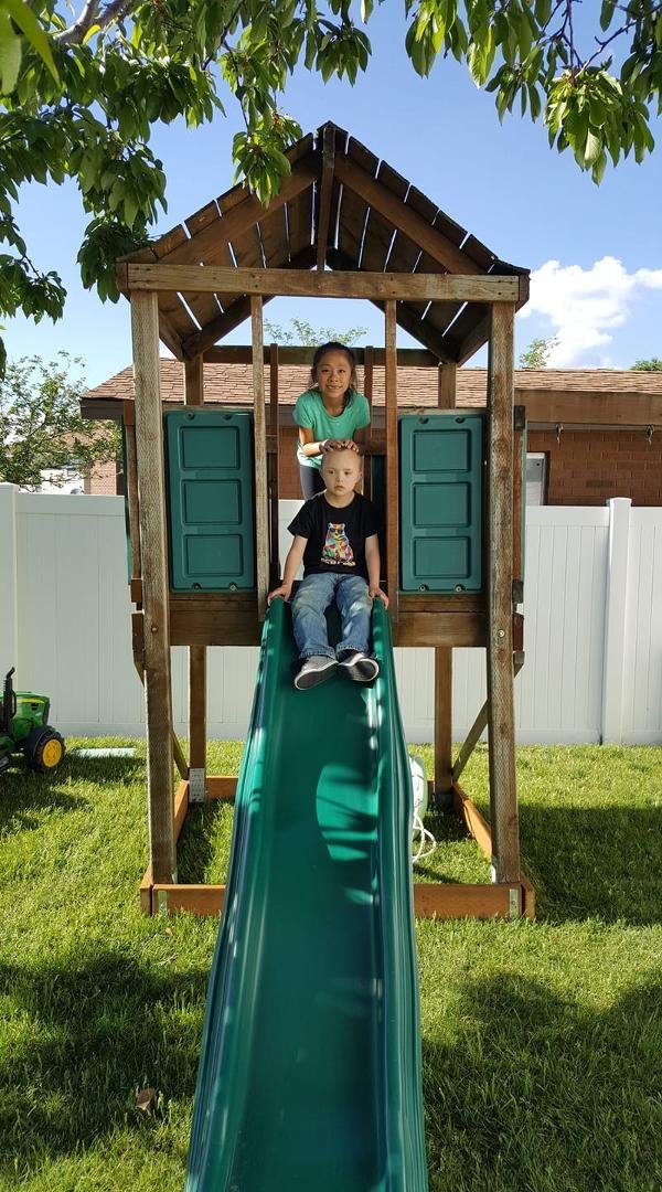 Grand kids playing in on playset.