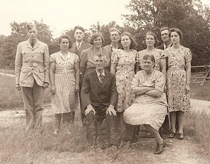 More siblings. This is an oldie taken in 1942. My paternal grandparents, George and Anna Raison, and their nine children. My dad is on the left. He was the second youngest of nine children. The youngest, Aunt Clara, is on t