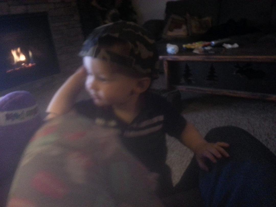 Grandpa's little man wearing my hate. He's such the little dude.