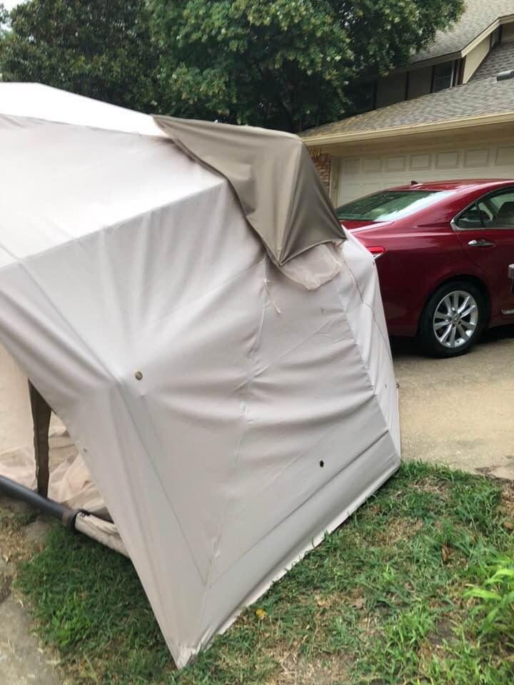 We went outside to head to church this morning and found a surprise. Our neighbor’s shade tent was evidently lifted by the wind last night over his 12foot fence and down into our driveway n striking our car in the process.