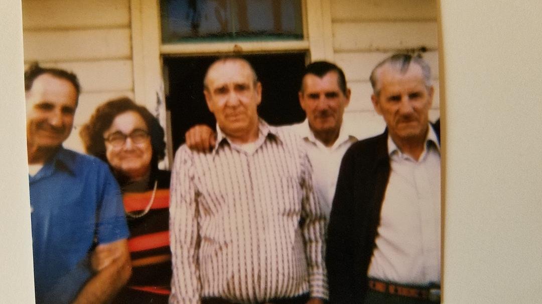 Left to right: Sherman (Rusty) Bartlett, Rusty's wife, Florence Bartlett, Ernest Bartlett, Cyril Bartlett, and Thade Bartlett.