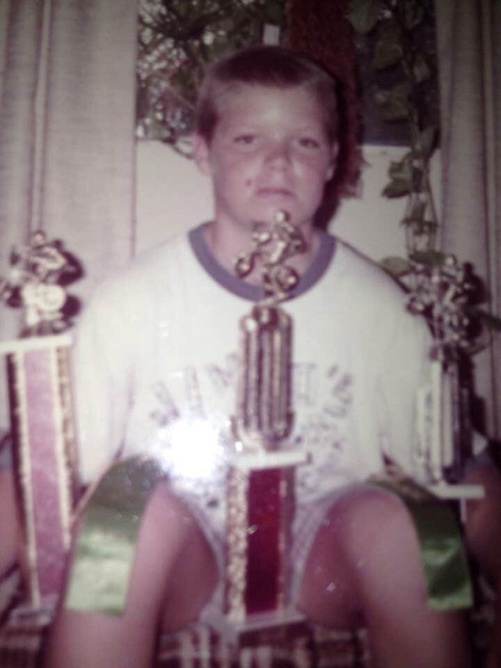 Peter, age 12, showing off his BMX trophies and ribbons.  Miss.  💔