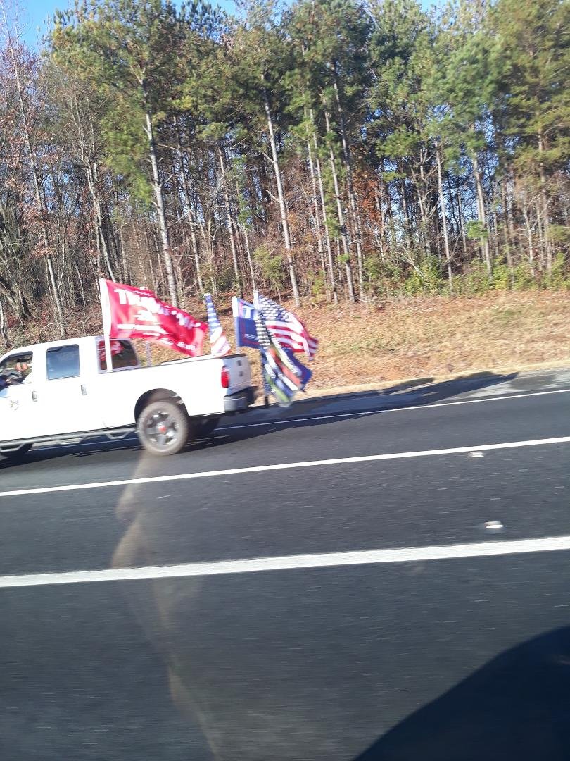Just passed a large caravan oh trucks and cars flying Trump flags on I 75 south.