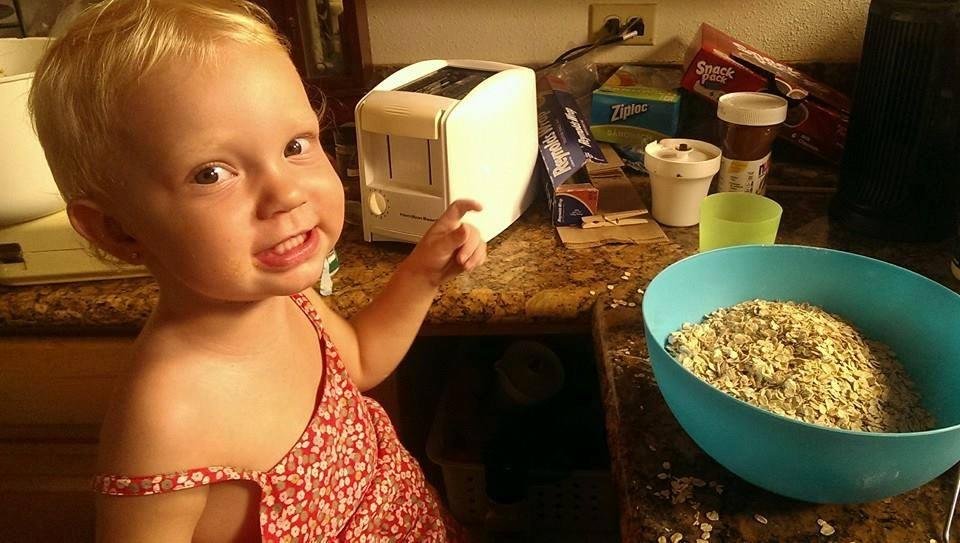 Alora helping mommy make cookies.