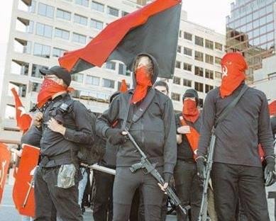 Now, look at the guy on the right. At his mask. See what's on it? Do you still have any question as to what the agenda of this "anti-fa" group is? I didn't think so.