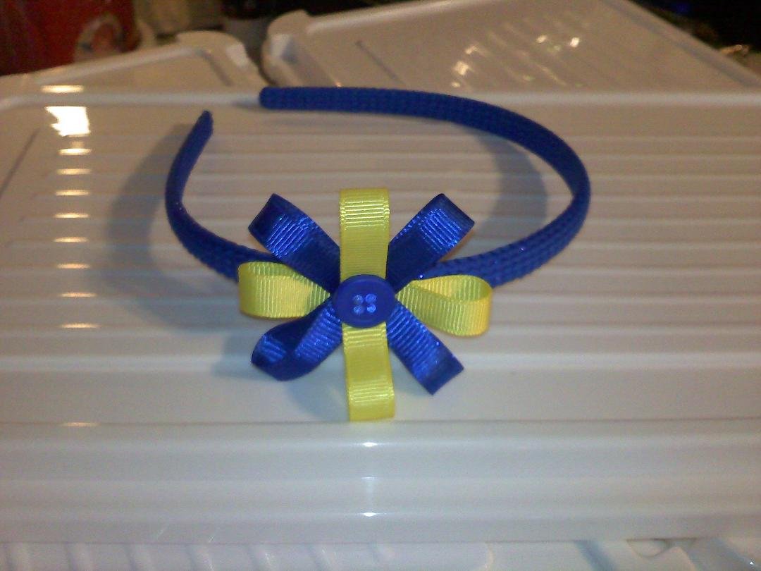 Blue and yellow headband reg price 3.00 and 1.50 for shipping but first to comment can get them for 2.50 and 1.00 for shipping