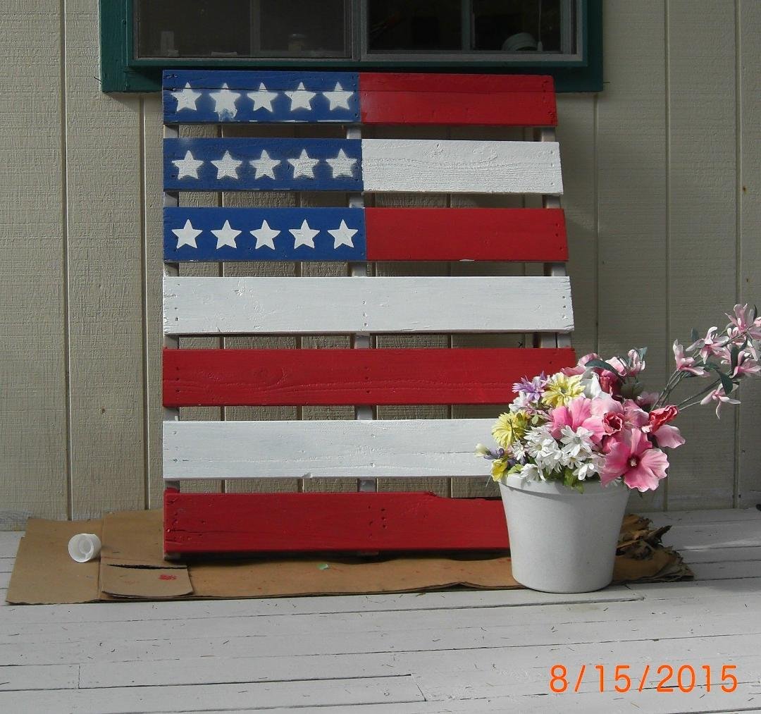 I knew I saved those pallets for something First attempt at yard art!!!