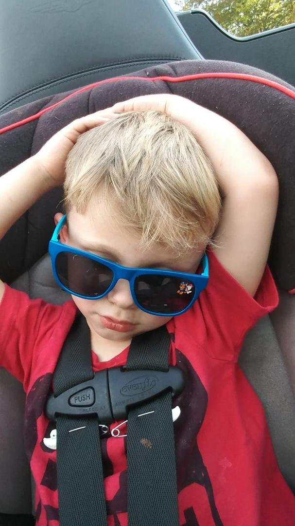 One tuckered boy. He was waving his hands in the wind. Suddenly it was nap time!
