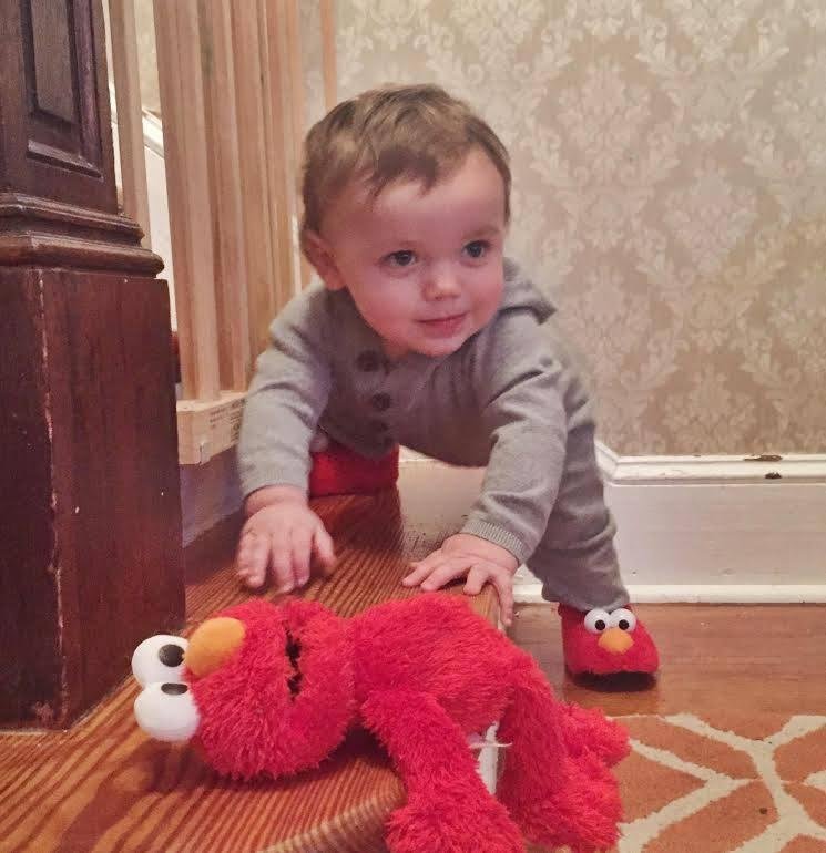 Grandude's favorite Grand son in his new Elmo slippers.  Leo's getting ready to walk--lock the doors and drawers in Hamilton!