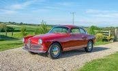 Alfa Romeo Guiletta Sprint Coupe.  I owned two of these - 1 1959 Normale (1.3L single downdraft Solex carb) and a 1961 Veloce (1.3L with hotter cams and dual Weber 45DCOE side draft carbs).  My '59 was red like tis one, wit
