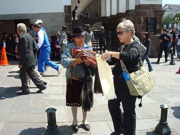Carmen buying a handwoven woolen scarf for $4