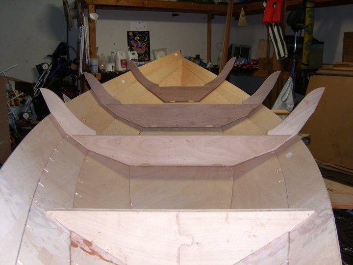 Stern view...three sides left to stitch. I'm glad...each side takes about an 1 1/2 hours to stitch. Step after that, tightening stitches, truing boat...then Epoxy seal joints...then...a very long hot shower.