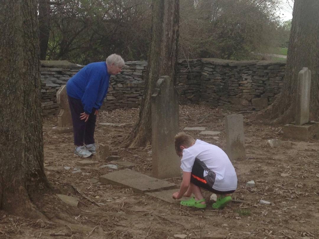 Mary Carson Cross and Carson Cross Looking at Samuel Carson's headstone at the Carson Cemetery in Concord Township, Delaware County Ohio